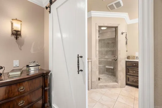 a bathroom with a shower and a sink