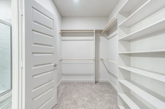 a view of an empty walk in closet