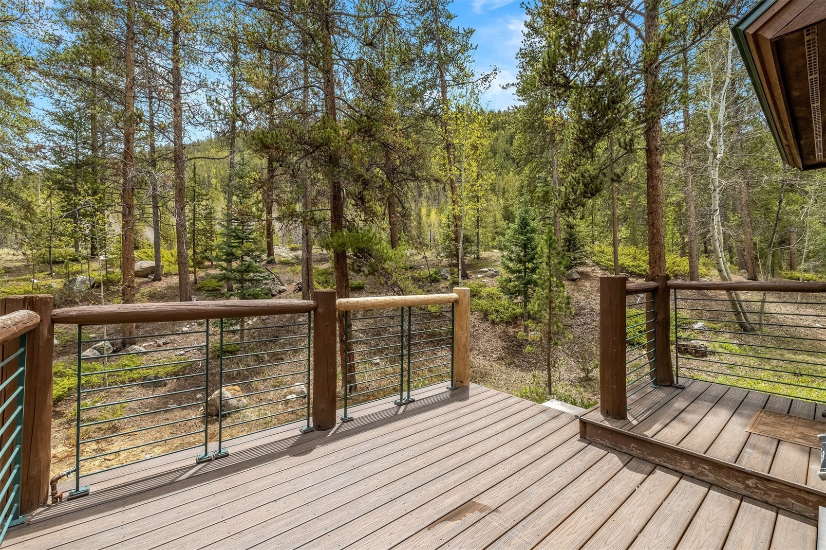 71 Starfire Lane, Unit 1978 Keystone, CO 80435 - Photo 9 of 40 a view of a balcony with wooden floor and fence