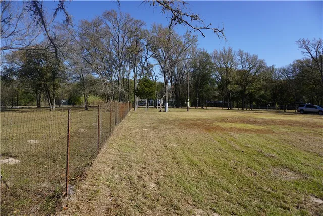 a backyard of apartments with trees