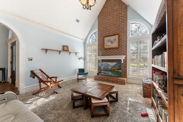 a kitchen with stainless steel appliances granite countertop a refrigerator a stove and a sink with cabinets