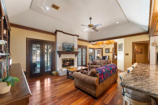 a living room with lots of furniture and a chandelier