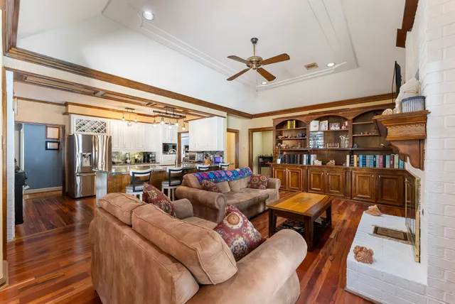 a bedroom with a bed and a flat tv screen on dresser