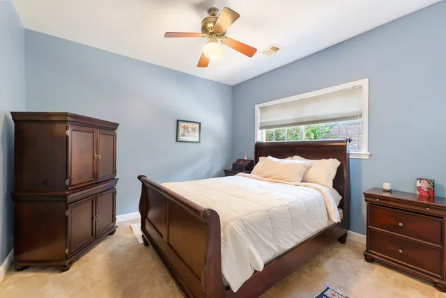 a bathroom with a granite countertop sink and a bathtub