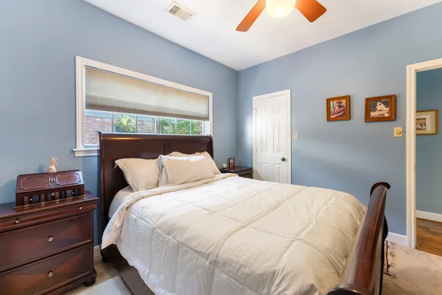 a spacious bathroom with a granite countertop sink mirror and shower