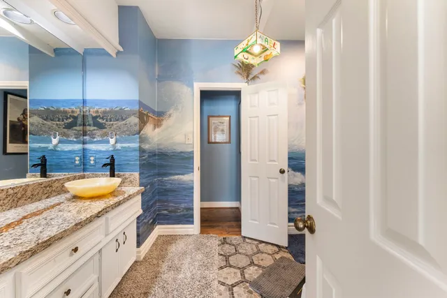 a view of a house with backyard porch and sitting area