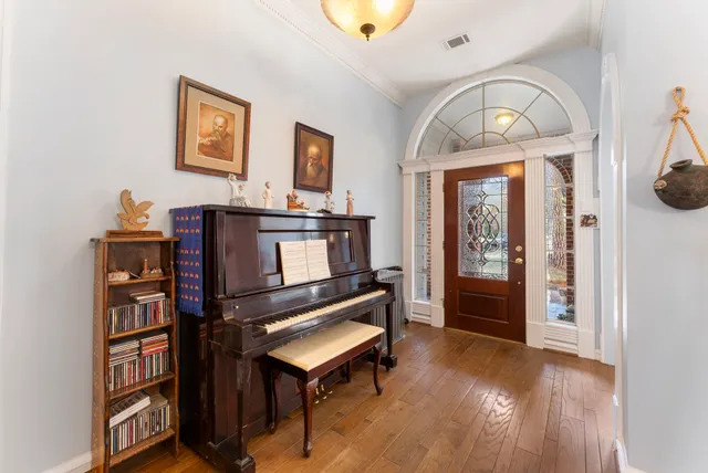 a living room with furniture and a book shelf