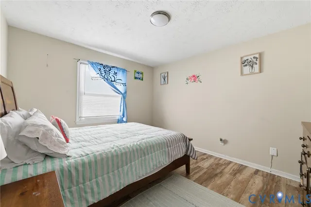 a bedroom with a bed and cabinets