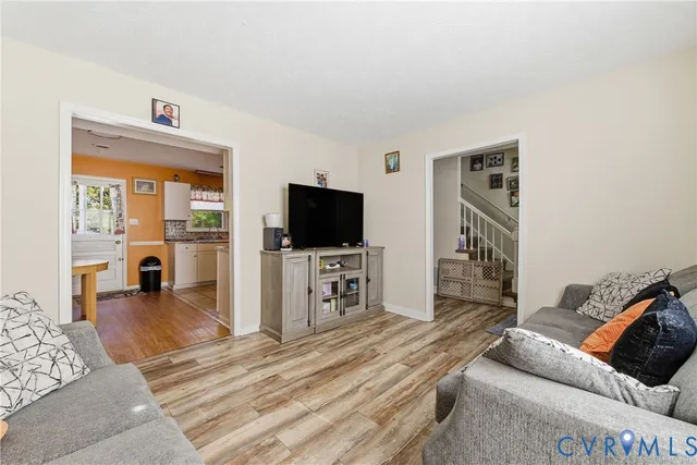 a kitchen with stainless steel appliances kitchen island granite countertop a refrigerator and stove