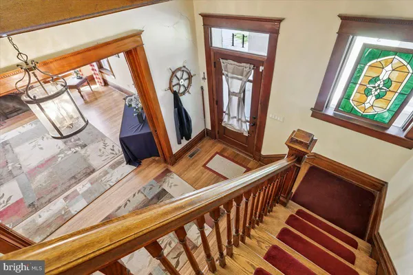a view of an entryway with furniture and a front door