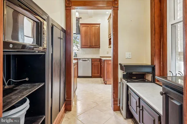 a kitchen with a stove and a refrigerator