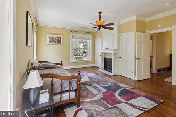 a bedroom with furniture and a window