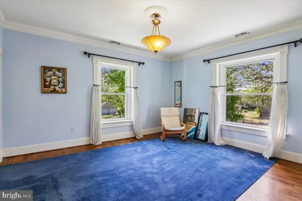 a view of a livingroom with furniture and a window