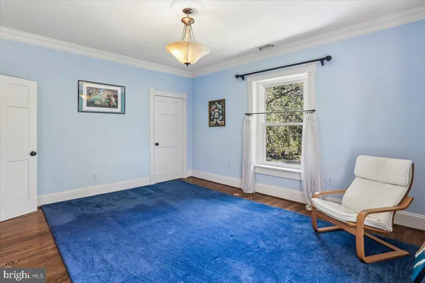 a view of entryway with wooden floor and stairs