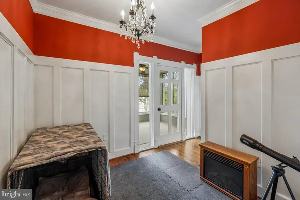 a view of an entryway with wooden floor and windows