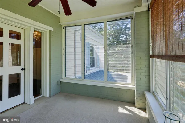 a view of front door with wooden floor