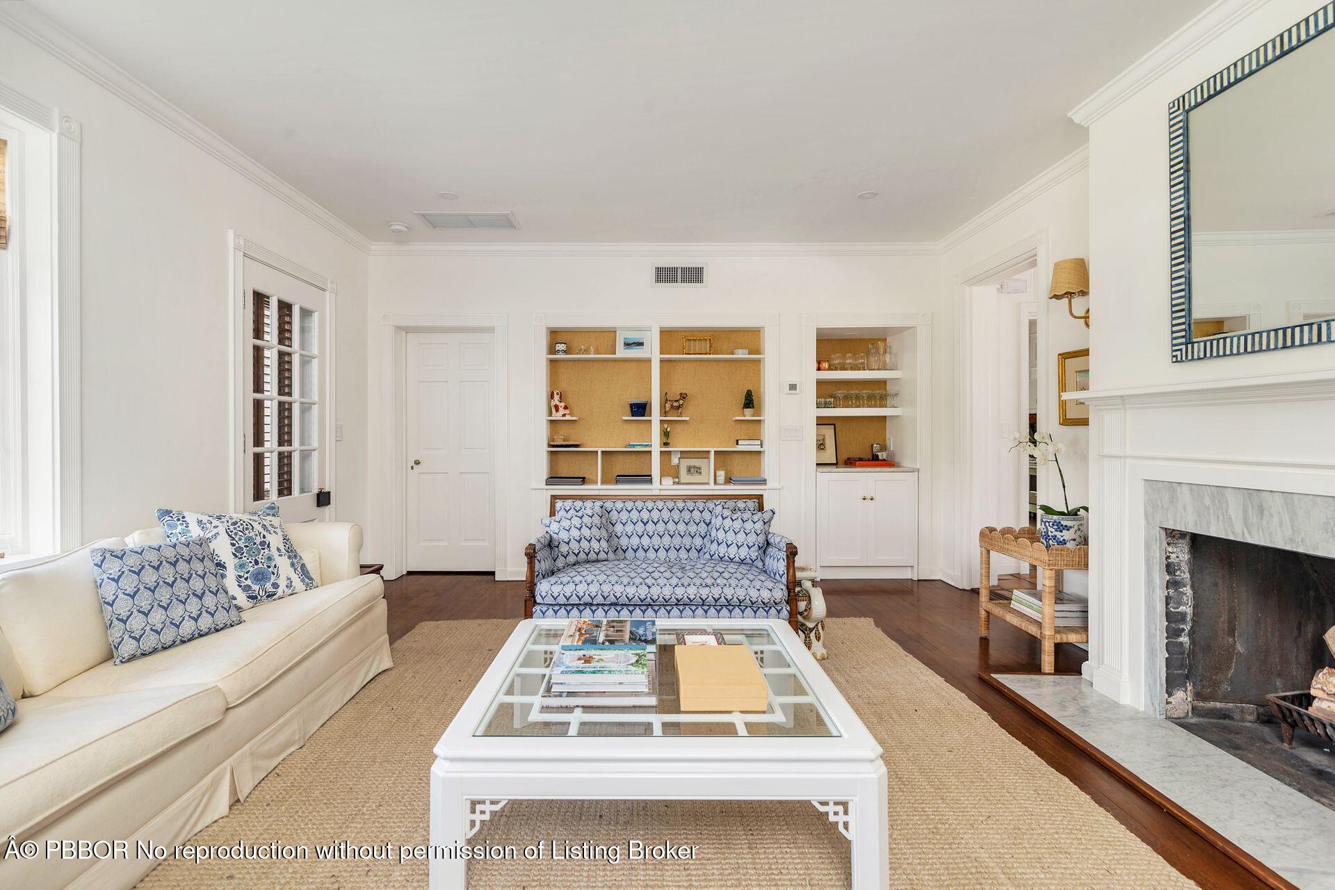 255 Colonial Lane Palm Beach, FL 33480 - Photo 5 of 32 a living room with furniture a fireplace and a flat screen tv