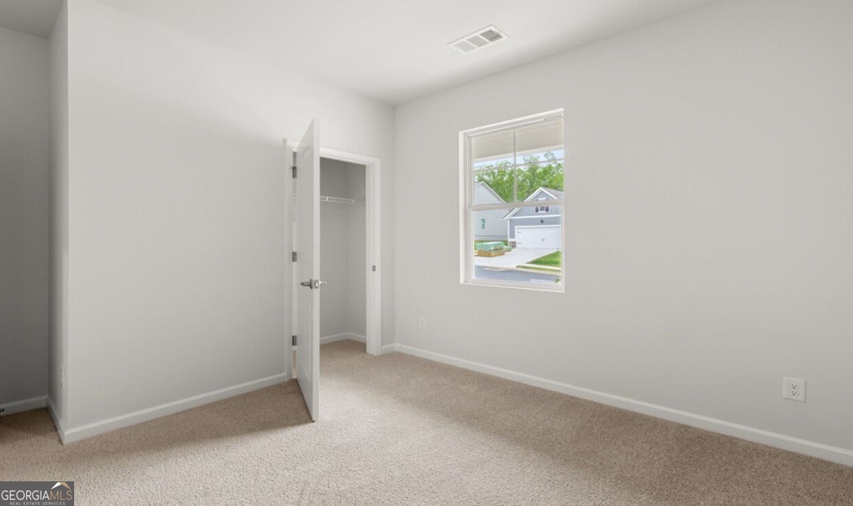 110 Babcock Drive Northeast Rome, GA 30165 - Photo 10 of 12 an empty room with windows and closet