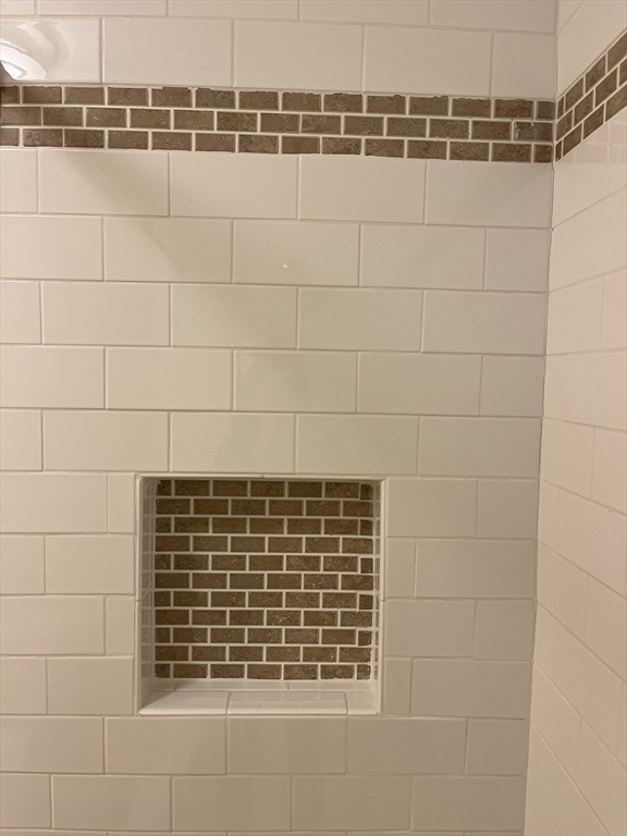 53 Jericho Road, Unit A Weston, MA 02493 - Photo 11 of 16 a bathroom with a shower