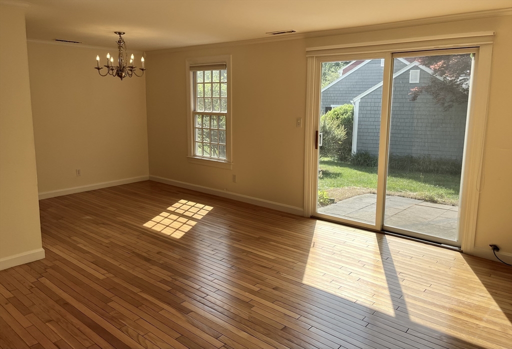 53 Jericho Road, Unit A Weston, MA 02493 - Photo 2 of 16 a view of empty room with wooden floor and fan