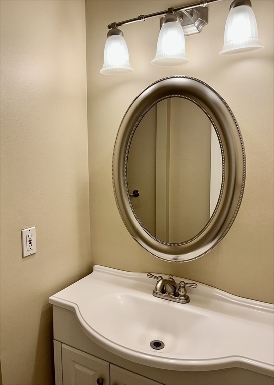 53 Jericho Road, Unit A Weston, MA 02493 - Photo 9 of 16 a bathroom with a sink and a mirror