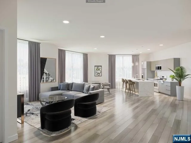 a living room with furniture and a table