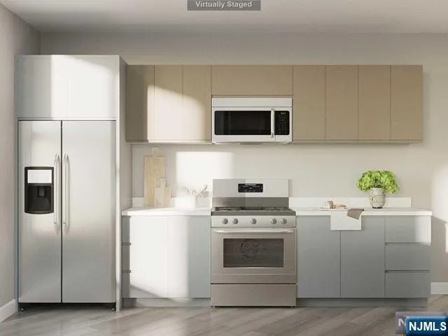 a kitchen with a stove and a microwave