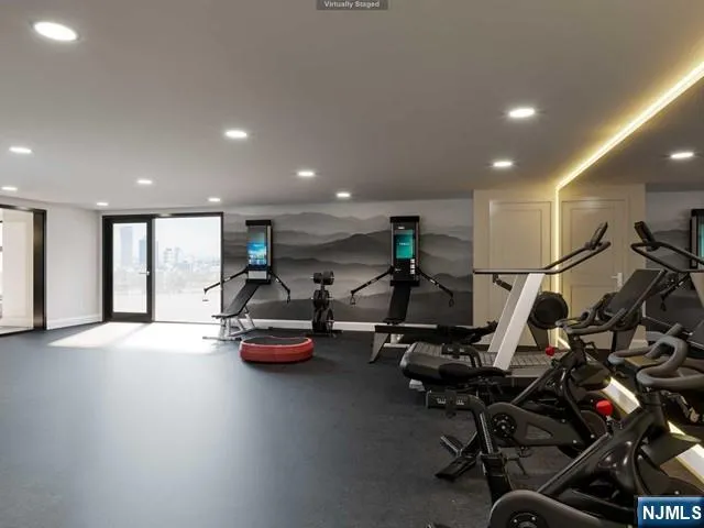 a room with gym equipment and windows