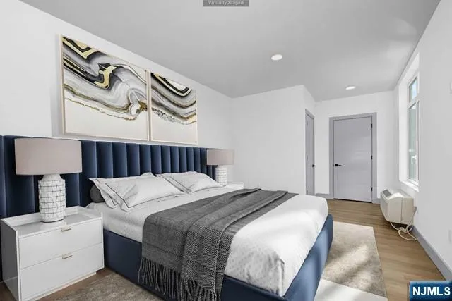 a bedroom with a bed and a lamp