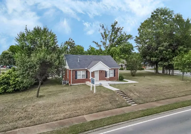front view of a house with a yard