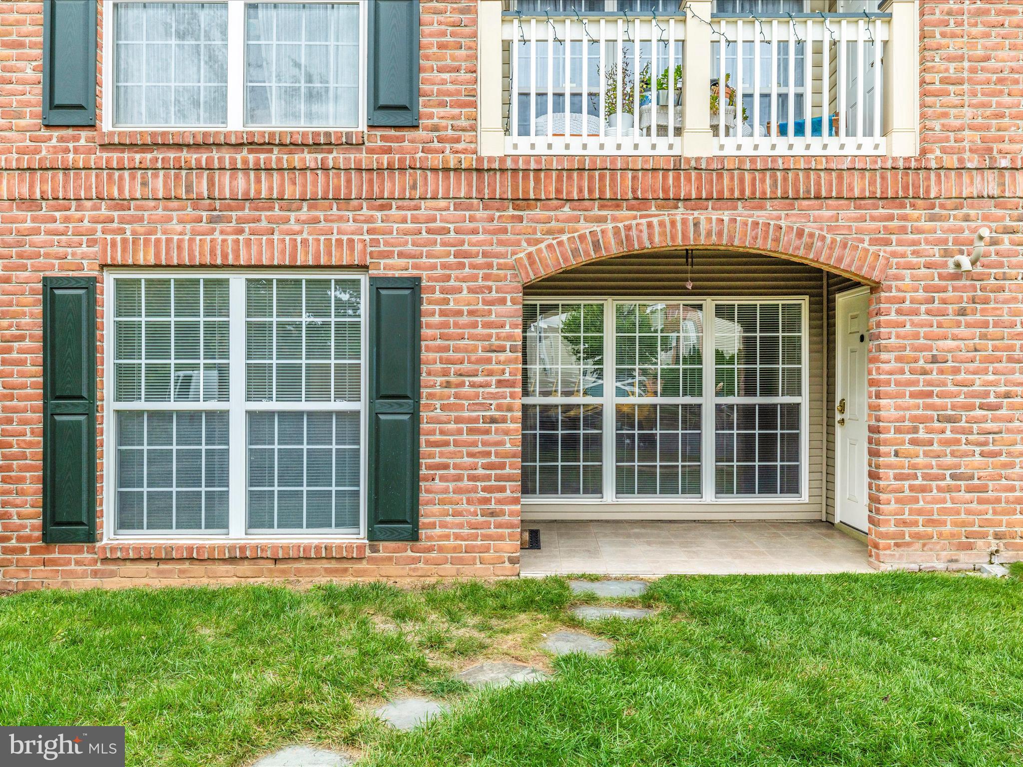 2508 Shelley Circle, Unit 8 1A Frederick, MD 21702 - Photo 20 of 48 a front view of a building with a garden