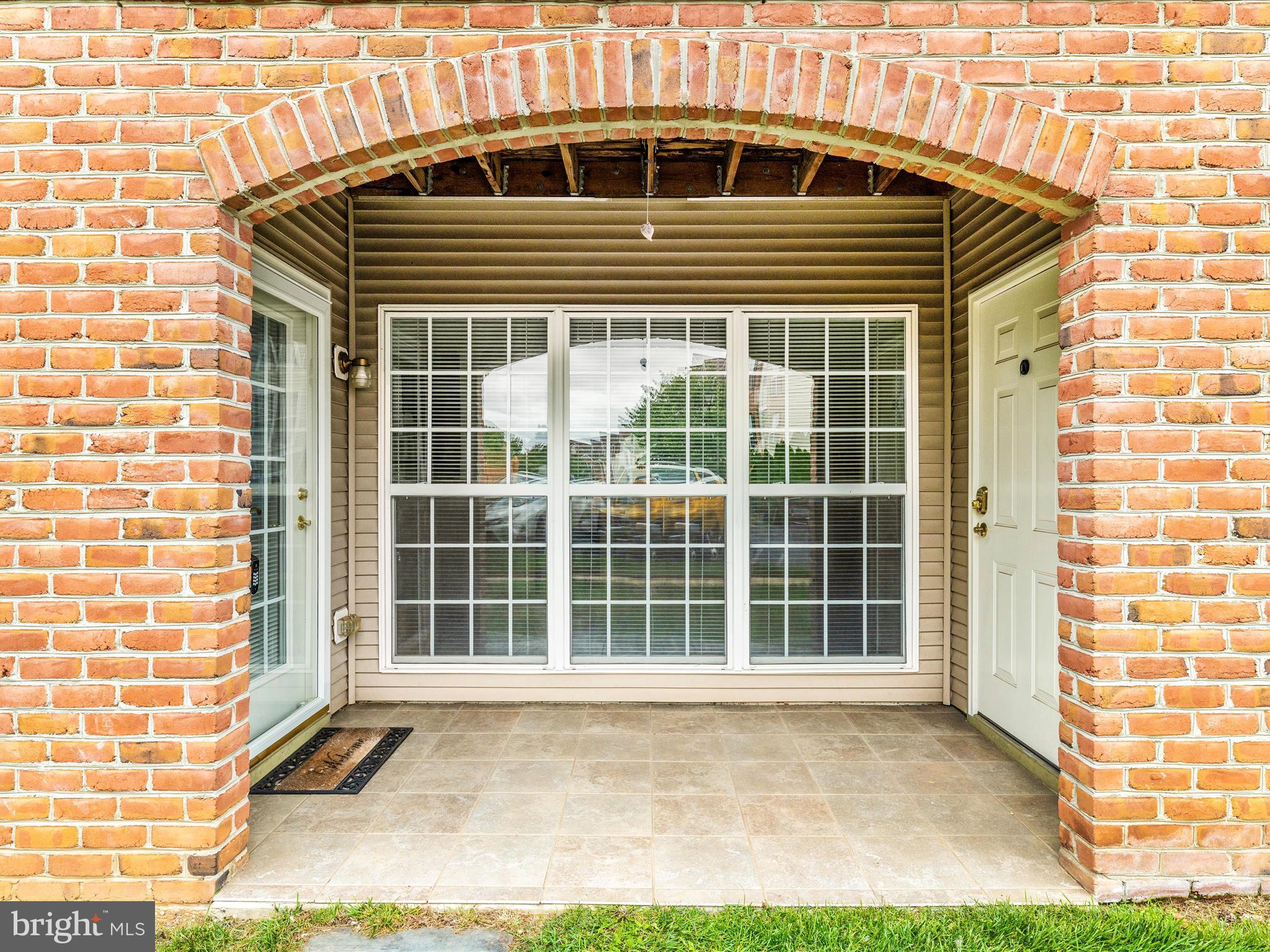 2508 Shelley Circle, Unit 8 1A Frederick, MD 21702 - Photo 23 of 48 a front view of a house with a yard