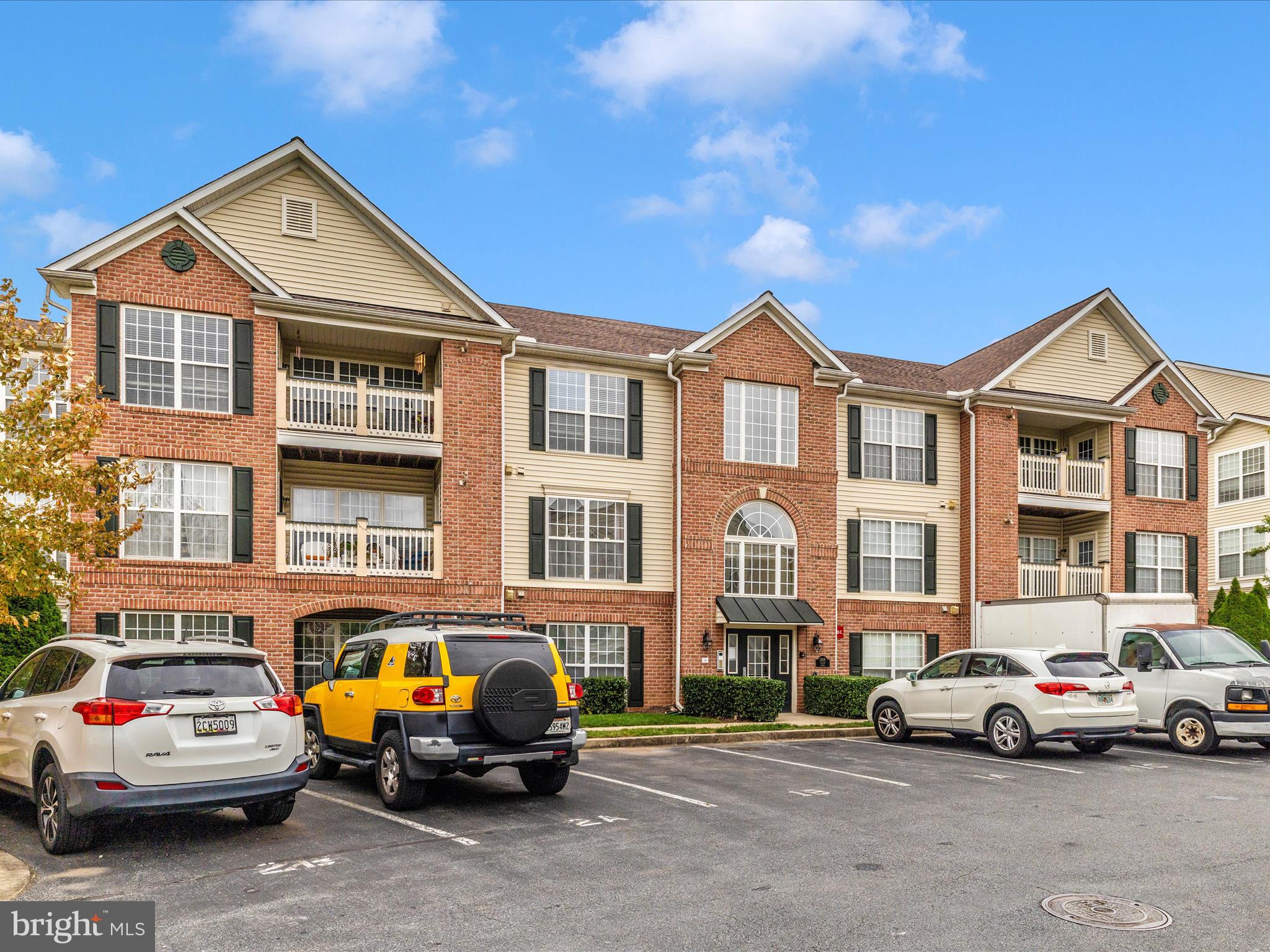 2508 Shelley Circle, Unit 8 1A Frederick, MD 21702 - Photo 25 of 48 a view of a cars park in front of a brick house