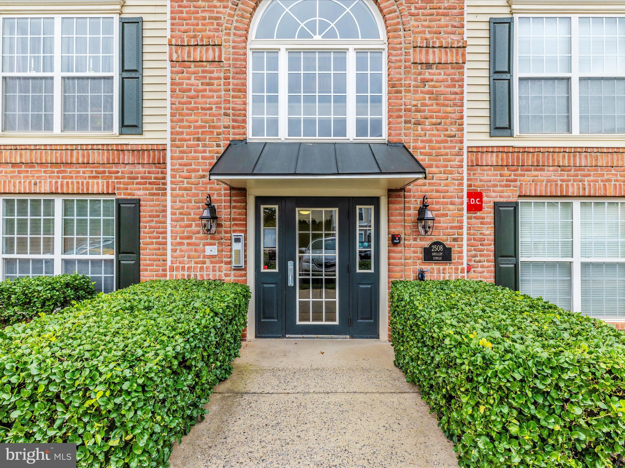2508 Shelley Circle, Unit 8 1A Frederick, MD 21702 - Photo 26 of 48 front view of a brick house with a large window