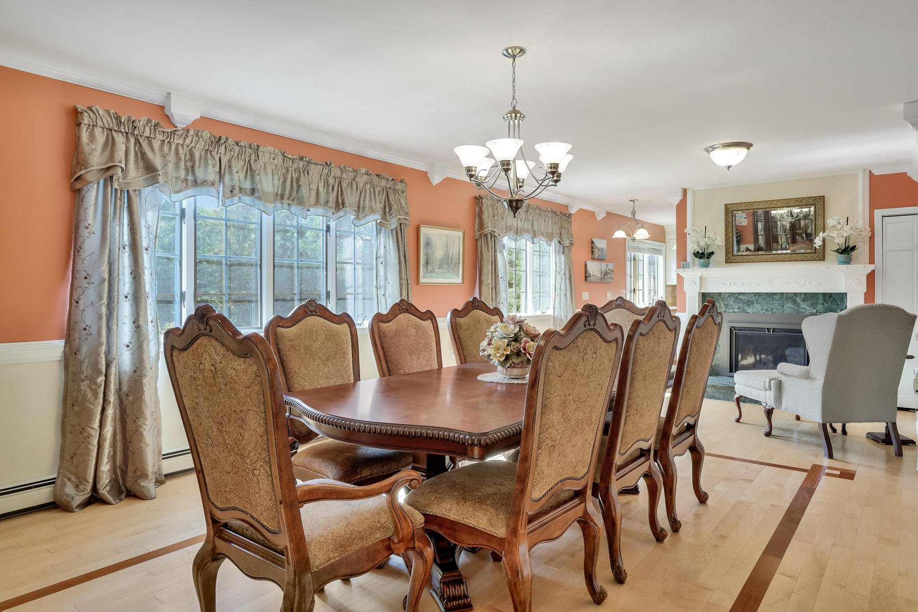 68 Monomoscoy Road Mashpee, MA 02649 - Photo 20 of 50 a view of a dining room with furniture a chandelier and wooden floor