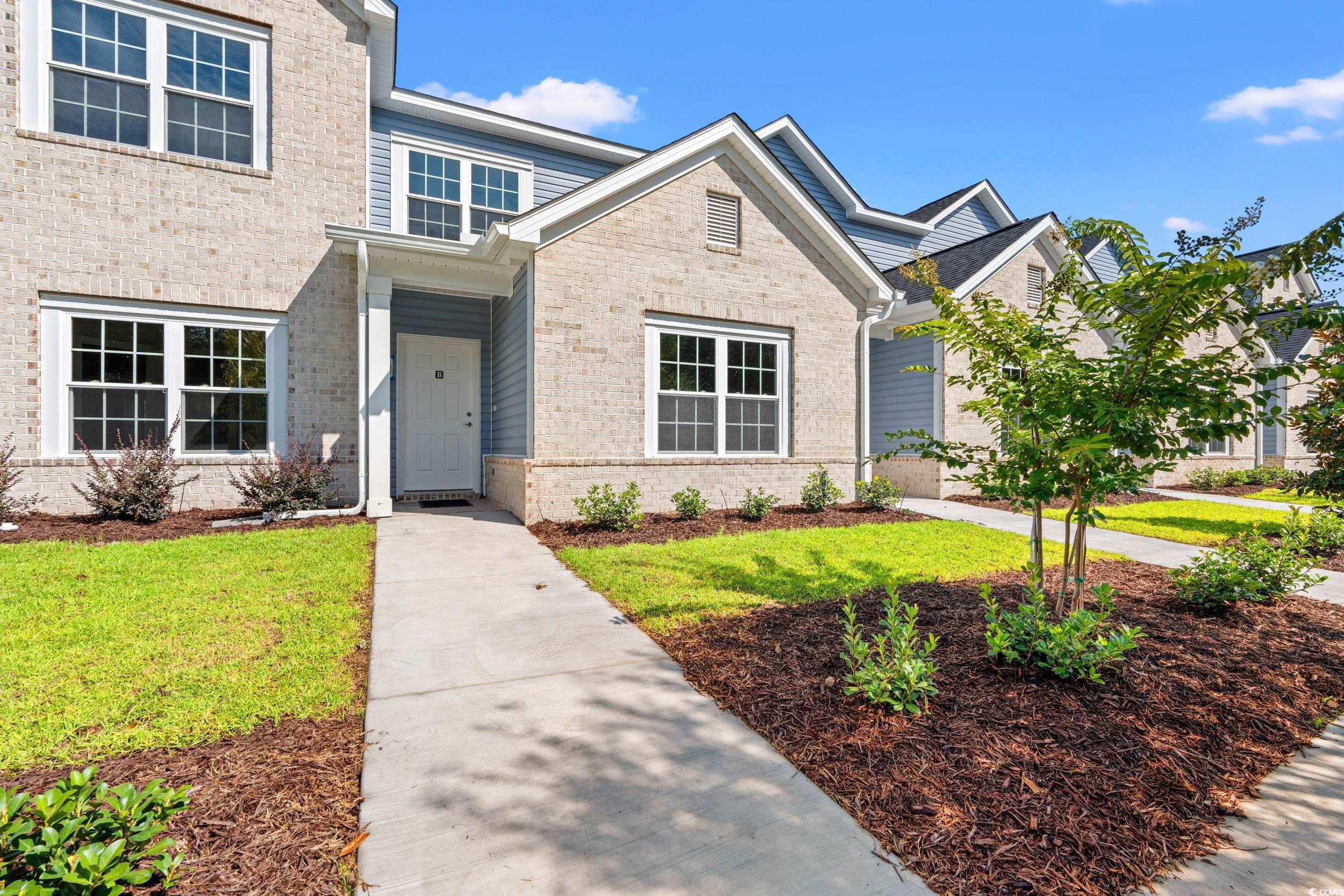 344 Kiskadee Loop, Unit E Conway, SC 29526 - Photo 1 of 36 View of front of home featuring a front yard