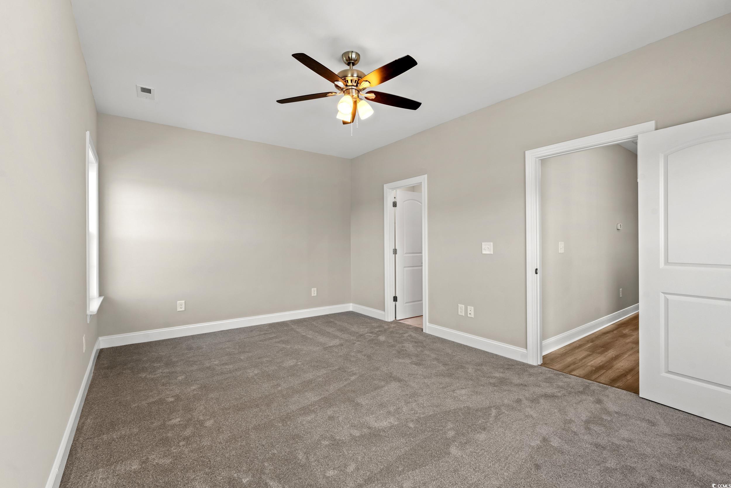 344 Kiskadee Loop, Unit E Conway, SC 29526 - Photo 11 of 36 Unfurnished bedroom featuring ceiling fan and carp