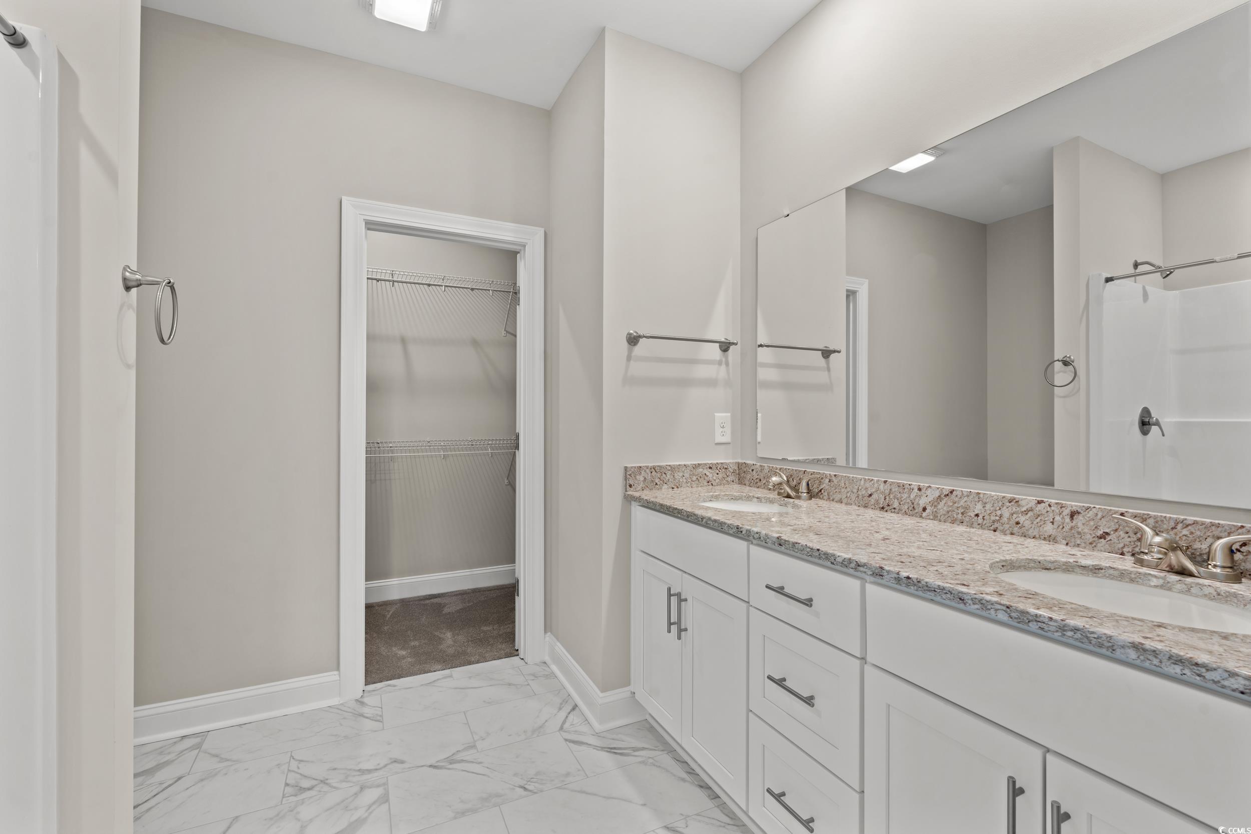 344 Kiskadee Loop, Unit E Conway, SC 29526 - Photo 13 of 36 Bathroom with walk in shower, double vanity, and t