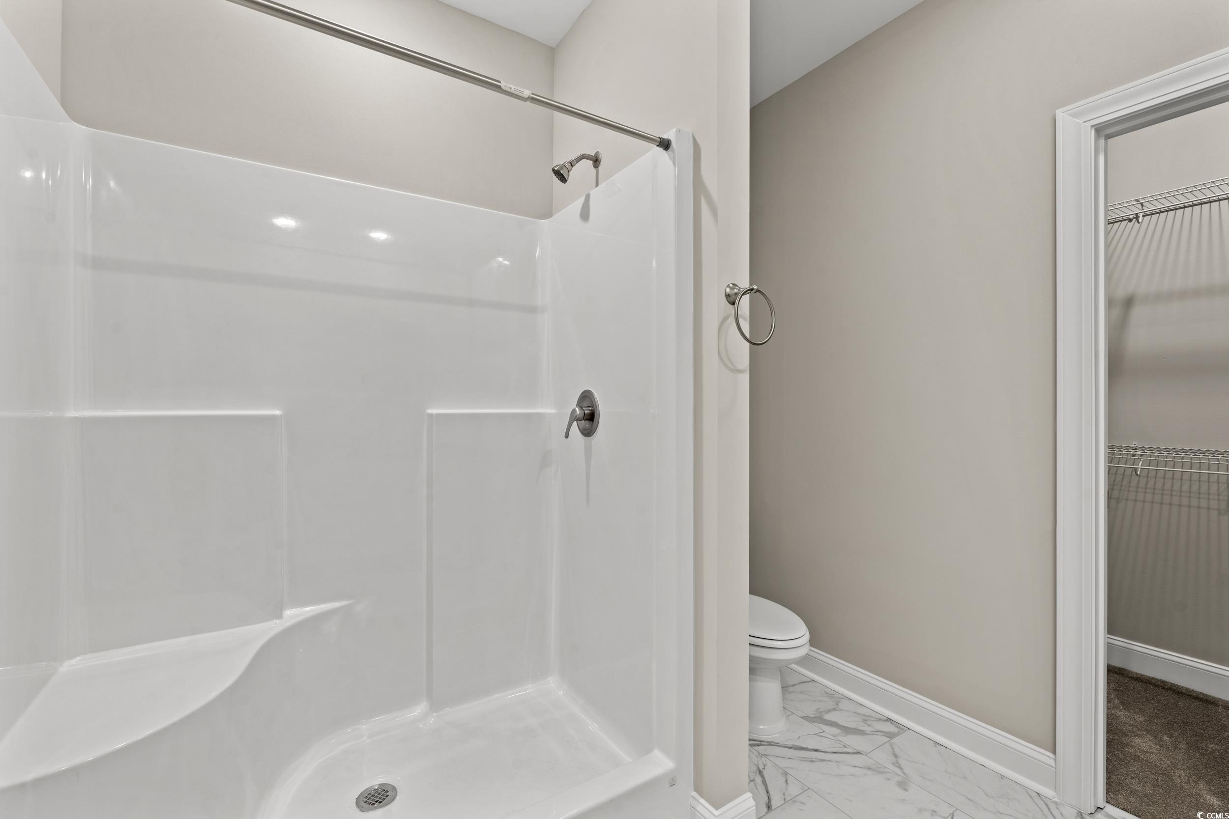 344 Kiskadee Loop, Unit E Conway, SC 29526 - Photo 15 of 36 Bathroom featuring a shower, tile patterned floori