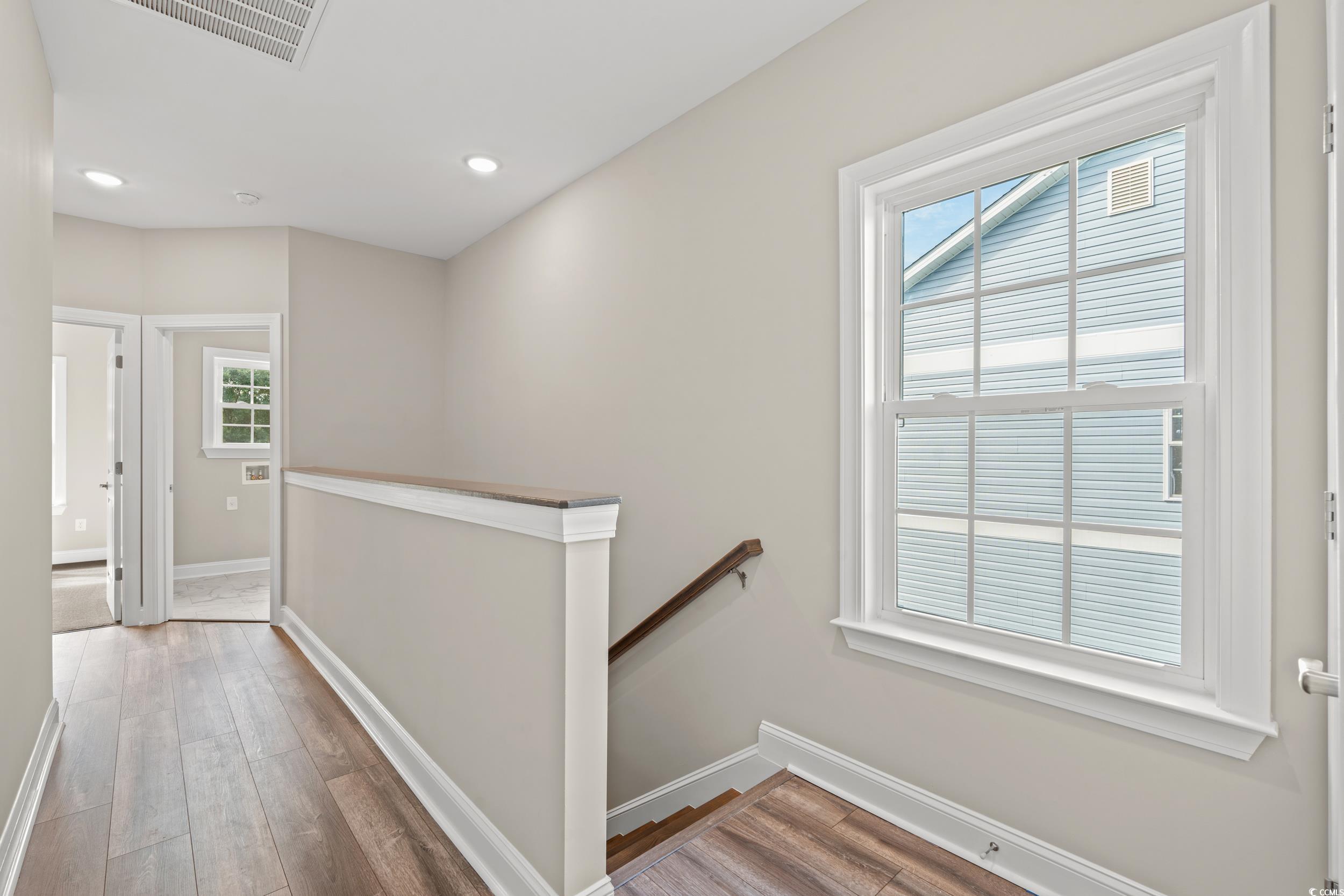 344 Kiskadee Loop, Unit E Conway, SC 29526 - Photo 16 of 36 Corridor featuring hardwood / wood-style floors an