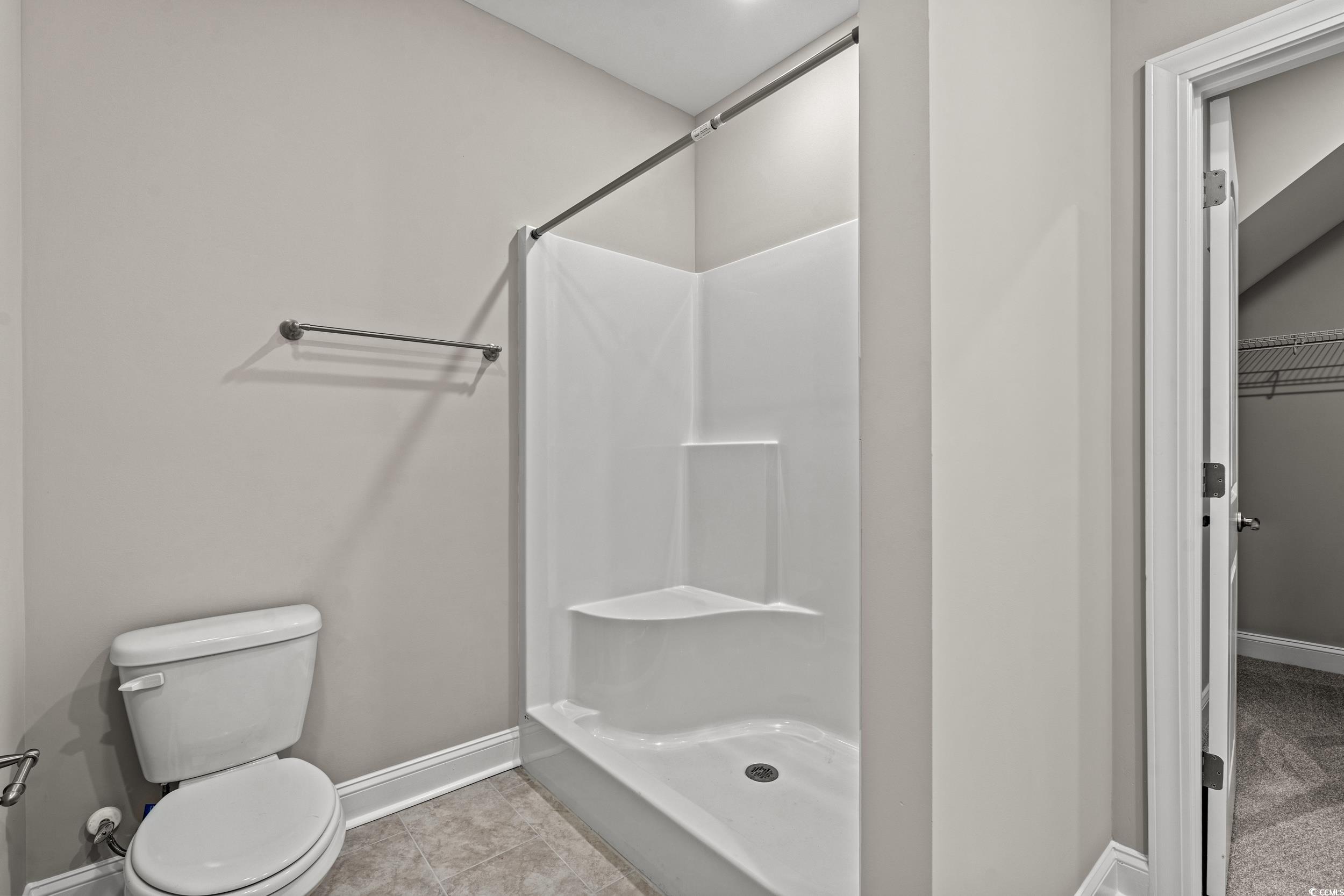 344 Kiskadee Loop, Unit E Conway, SC 29526 - Photo 23 of 36 Bathroom with tile patterned floors, a shower, and