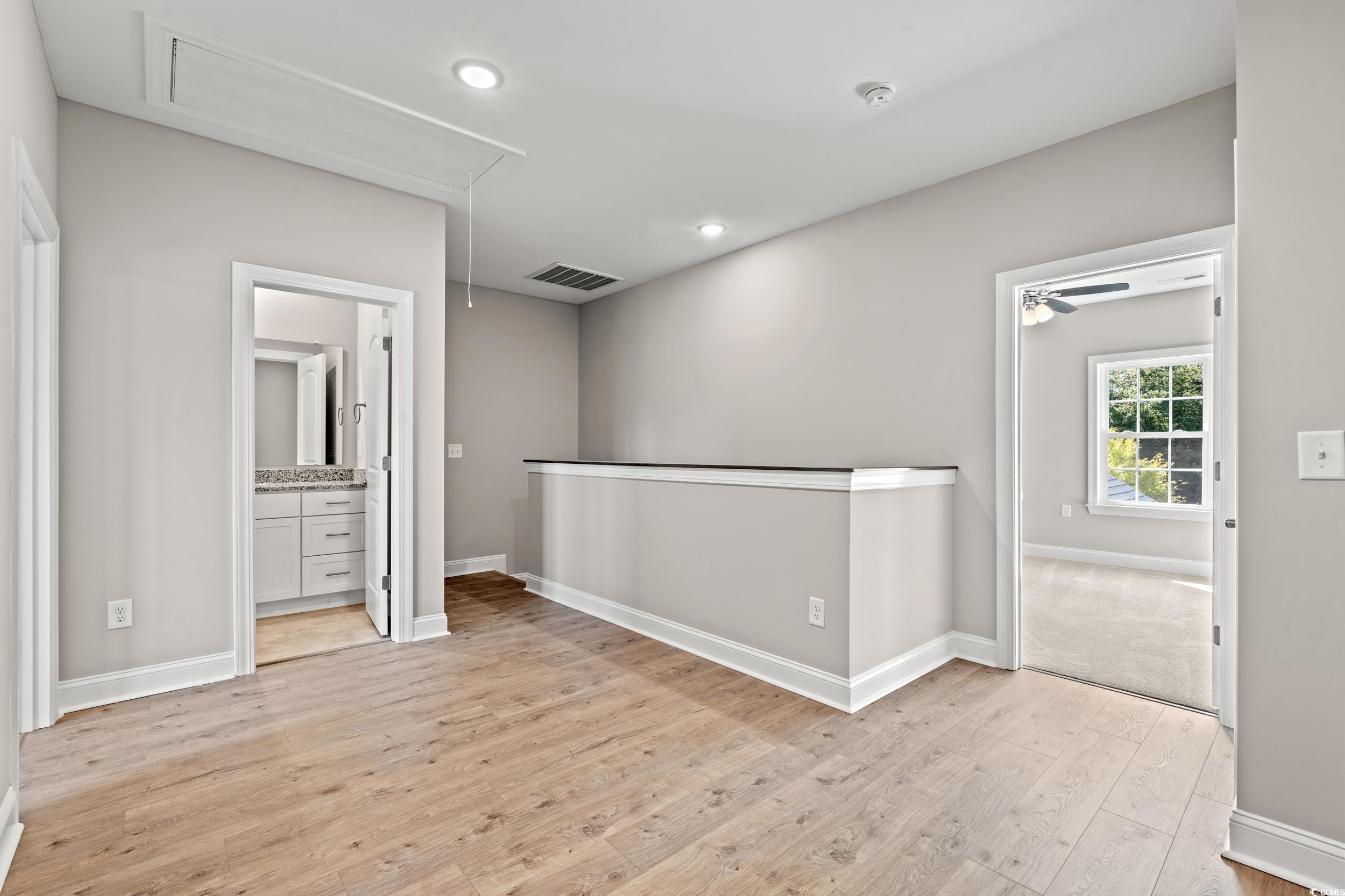 344 Kiskadee Loop, Unit E Conway, SC 29526 - Photo 26 of 36 Spare room featuring light wood-type flooring and