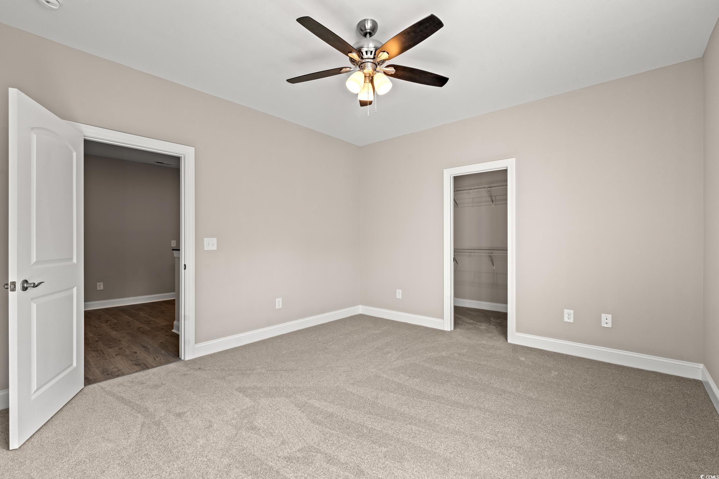 344 Kiskadee Loop, Unit E Conway, SC 29526 - Photo 27 of 36 Unfurnished room with carpet flooring and ceiling