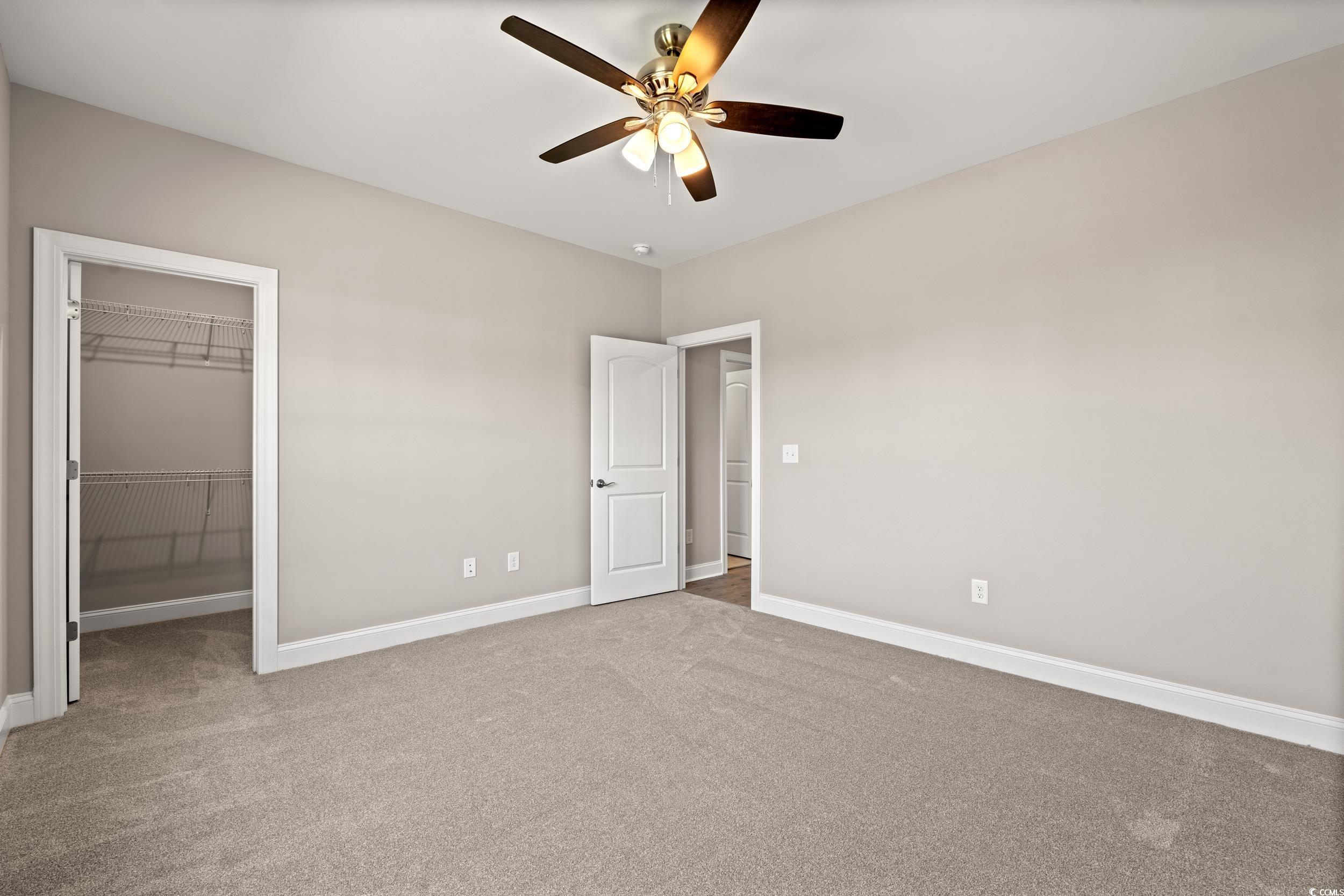 344 Kiskadee Loop, Unit E Conway, SC 29526 - Photo 30 of 36 Unfurnished bedroom featuring ceiling fan, carpet