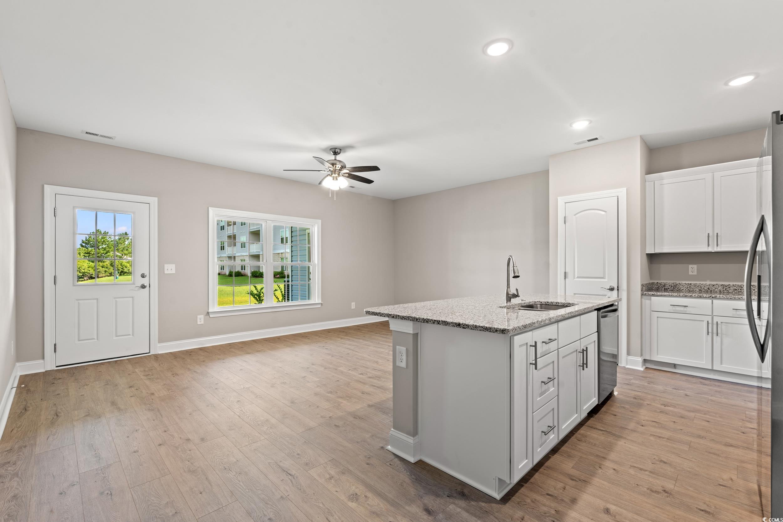344 Kiskadee Loop, Unit E Conway, SC 29526 - Photo 3 of 36 Kitchen featuring sink, light hardwood / wood-styl