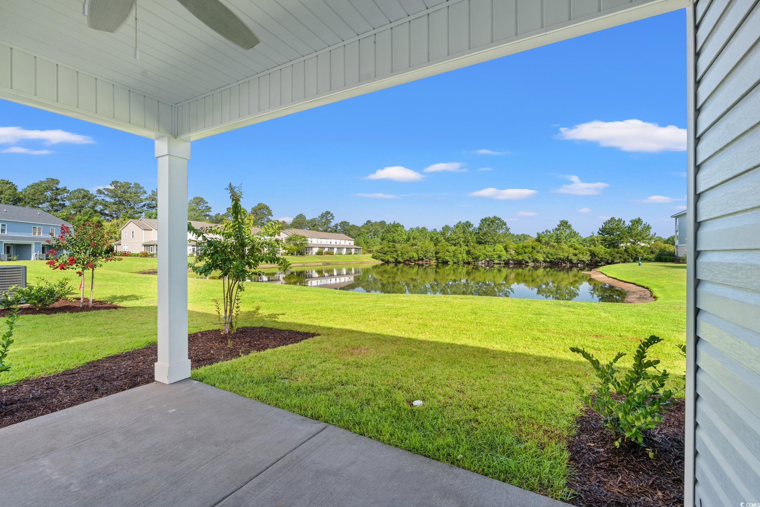 344 Kiskadee Loop, Unit E Conway, SC 29526 - Photo 32 of 36 View of yard featuring ceiling fan and a water vie