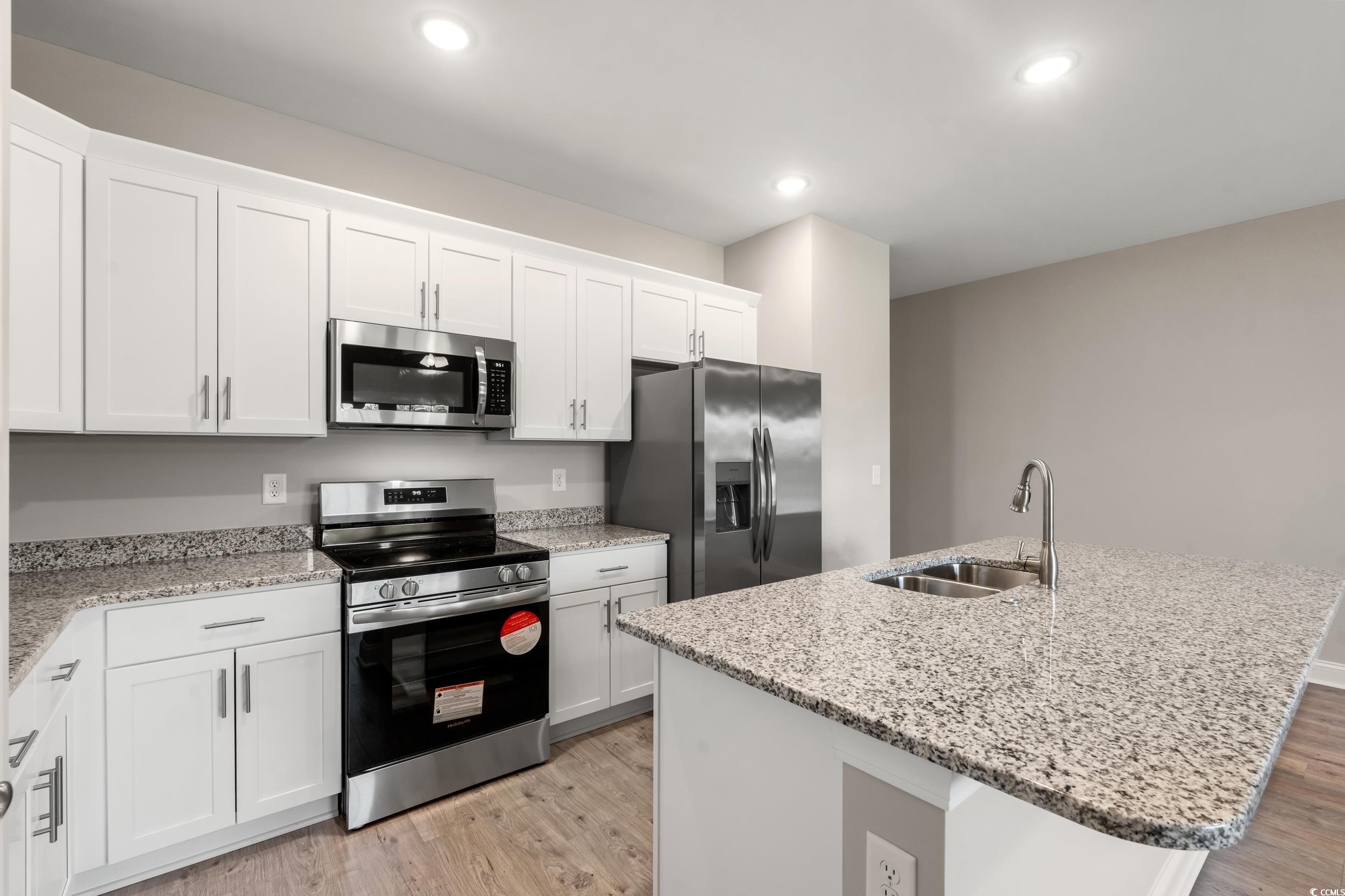 344 Kiskadee Loop, Unit E Conway, SC 29526 - Photo 5 of 36 Kitchen with sink, stainless steel appliances, a k