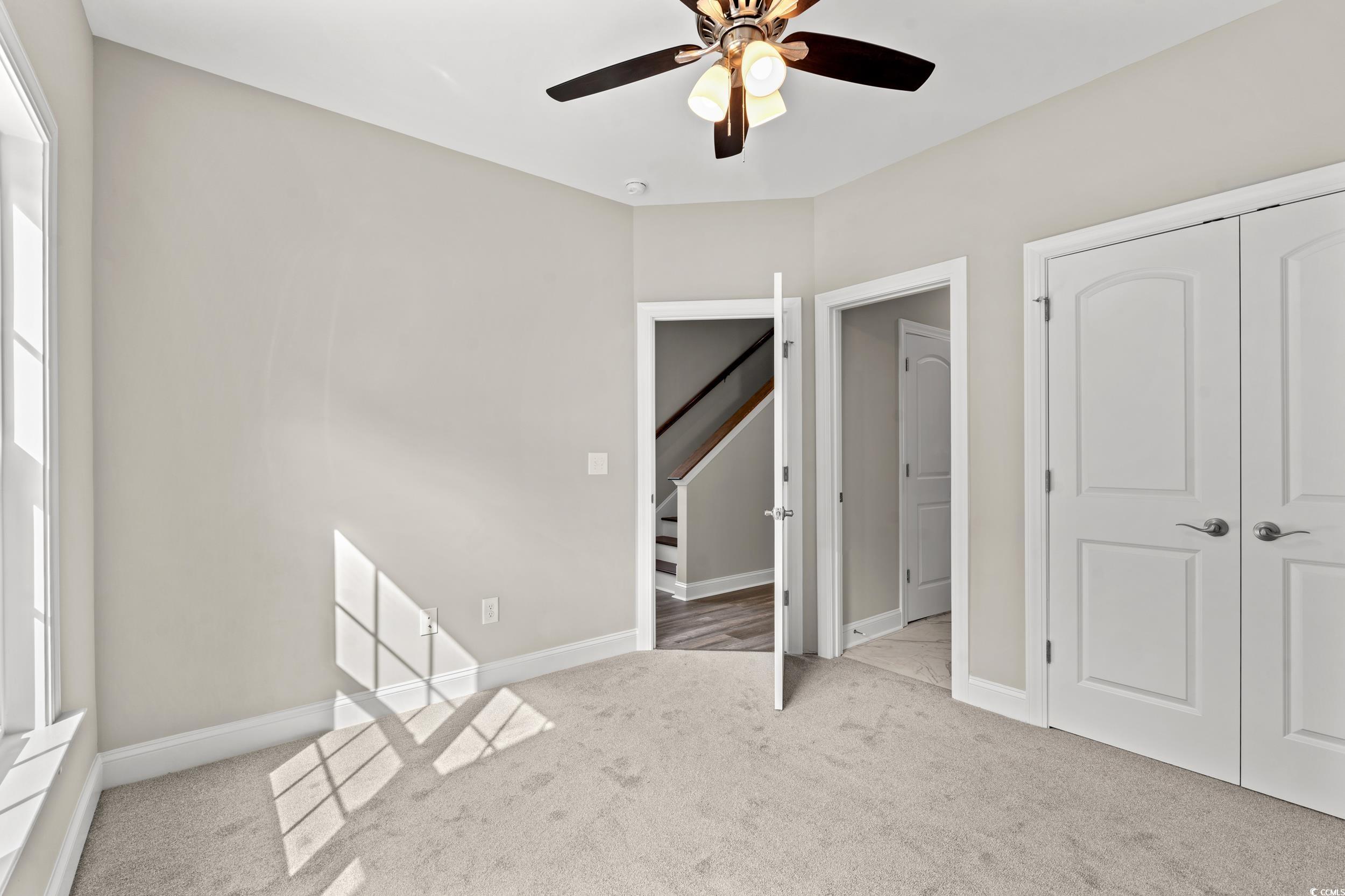 344 Kiskadee Loop, Unit E Conway, SC 29526 - Photo 8 of 36 Unfurnished bedroom with a closet, ceiling fan, an