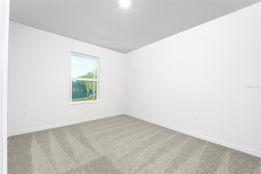 13466 Leaping Water Way Astatula, FL 34705 - Photo 15 of 21 a view of an empty room with a window