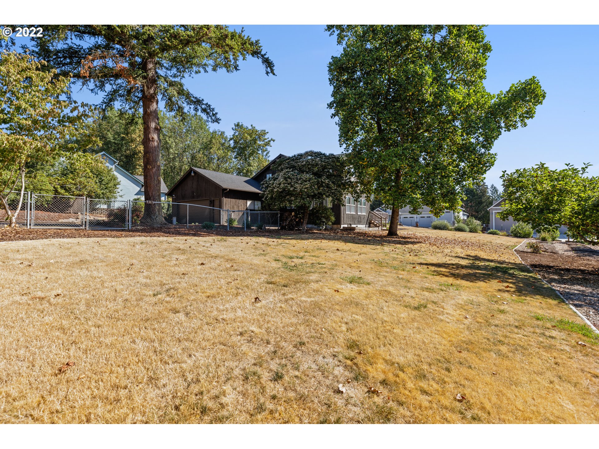 3903 Southeast Stiles Road Washougal, WA 98671 - Photo 23 of 28 a house with trees in the background